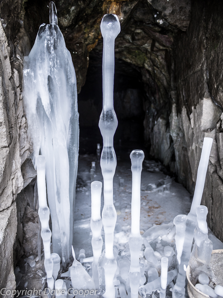 Luminous ice formations in an old mine entrance near Ouray, Colorado
